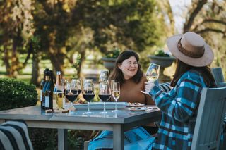 Two Woman Enjoying a Glass of Wine