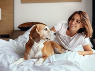 woman smiling at dog