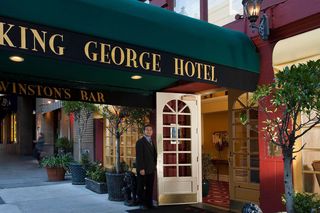 The doorman opened the King George lobby door.