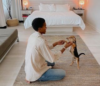 Guest playing with their dog.