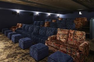 Luxurious rows of sofas at The Aster's cinema.